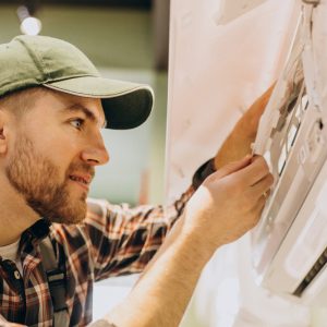 repairman-doing-air-conditioner-service (1) repairman-doing-air-conditioner-service (1)